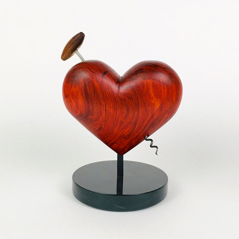Brazilian Red Heart wood with Mid-Century corkscrew.